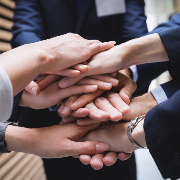 close-up of hands stack of business people